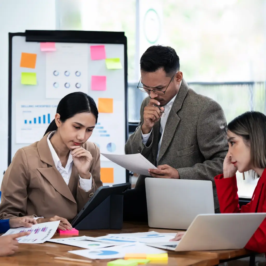 A group of employees brainstorming for a project.