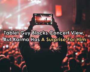 A guy holding a tablet in a jam-packed concert.